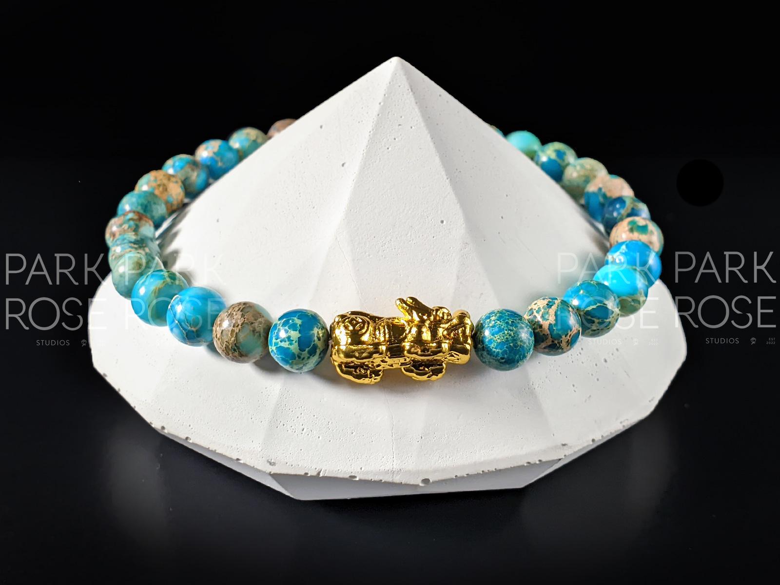 Lake Blue Jasper Bracelet: 24K Gold Plated Pixiu Charm