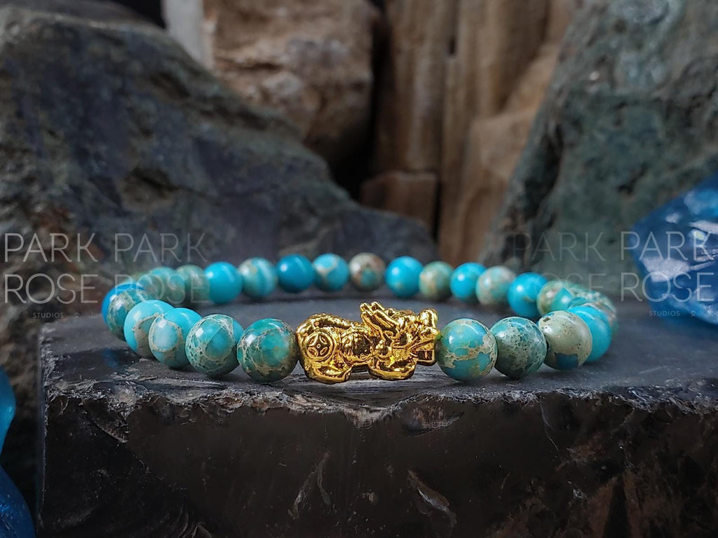 Lake Blue Jasper Bracelet: 24K Gold Plated Pixiu Charm