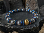 Titanium Blue Hematite Gemstone Bracelet: 24K Gold Cat Eye Bead (10mm)