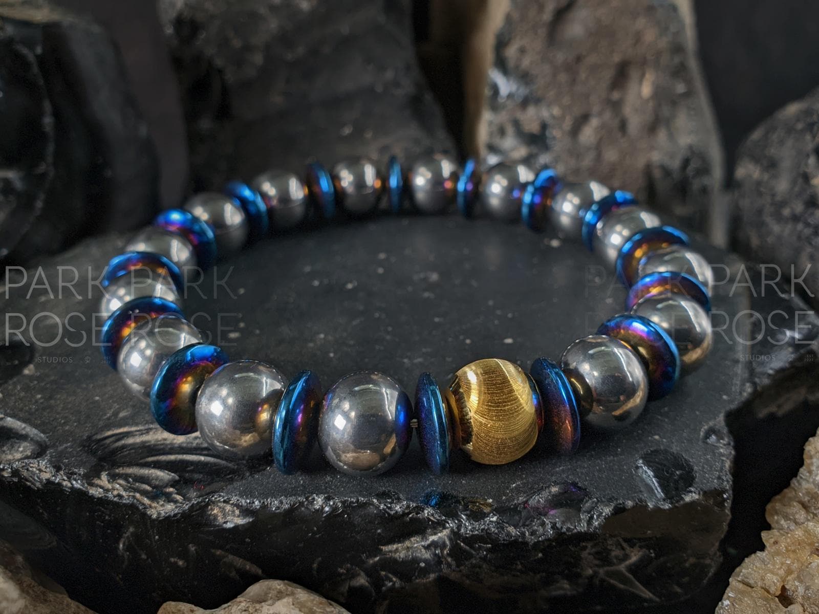 Titanium Blue Hematite Gemstone Bracelet: 24K Gold Cat Eye Bead (10mm)