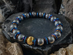 Titanium Blue Hematite Gemstone Bracelet: 24K Gold Cat Eye Bead (10mm)