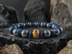Titanium Blue Hematite Gemstone Bracelet: 24K Gold Cat Eye Bead (10mm)