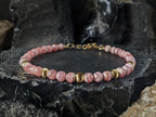 Dainty Argentinian Rhodochrosite Bracelet: 24K Solid Gold Cat Eye Bead (5mm)